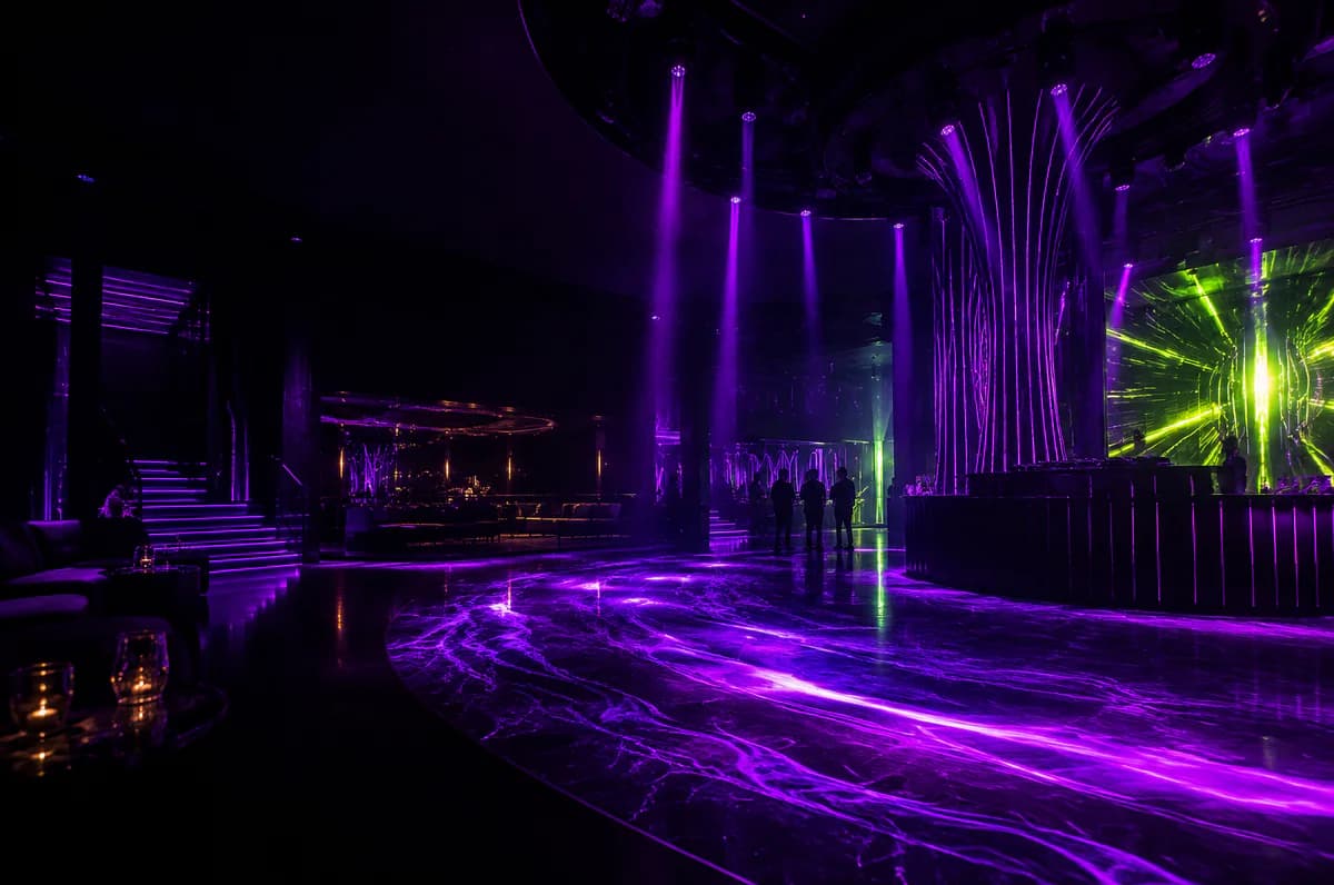 Premium black nightclub with purple and pink beams across a sculptural dance floor